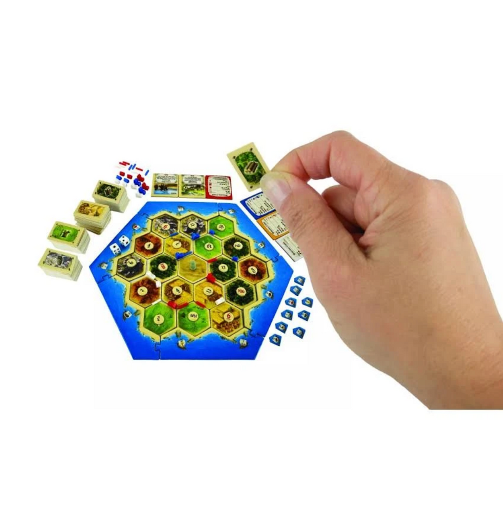 Miniature game board, cards, and tokens used to play the World's Smallest Catan. 