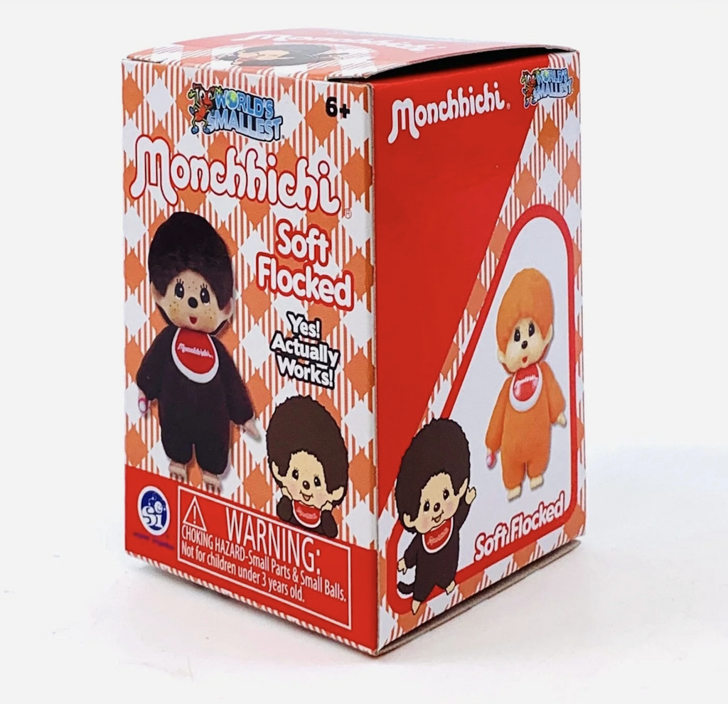 Red and white plaid box with illustrations and pictures of a brown Monchhichi and an orange Monchhichi. 