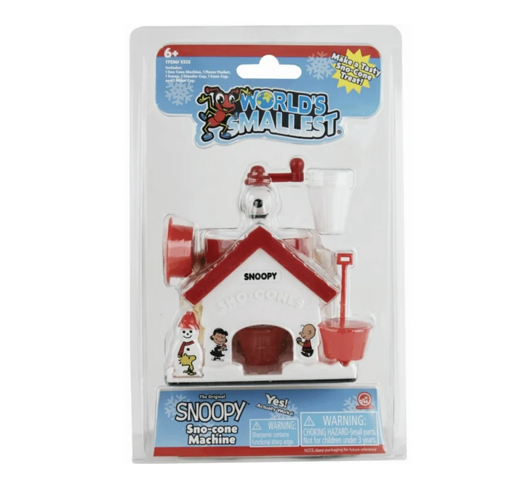 The World's Smallest Snoopy Sno Cone Machine in clear plastic packaging so that both the front and back of the retro sno cone maker can be seen 