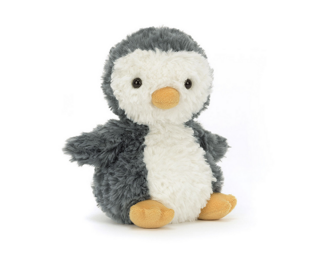 Small furry seated penguin plush.