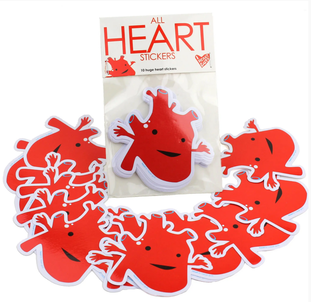 Bright red anatomical heart shaped sticker pack with the stickers spread out all around. 
