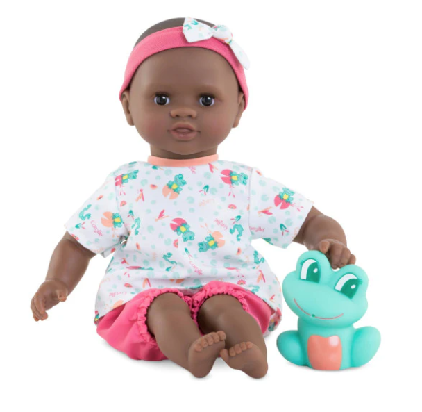 Alyzee Bebe bathy doll in a white shirt and pink shorts. Dark skin. Comes with a pet frog.