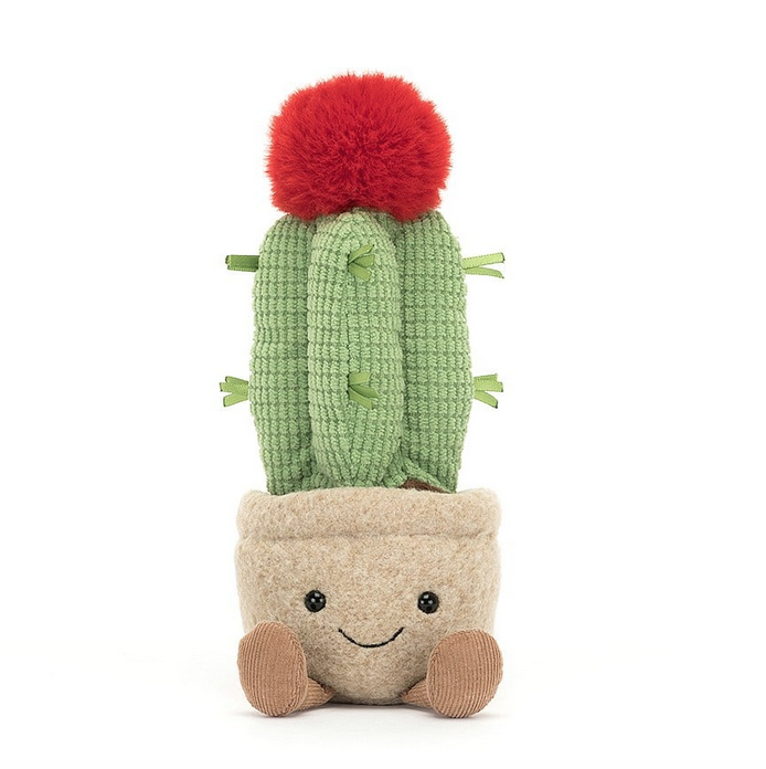 Plush Amuseable Moon Cactus facing forward with a smiling face and brown boots on it's pot. The green cactus with a red bloom on top. 
