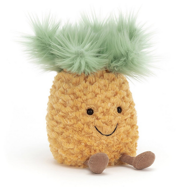 The Amuseable Pineapple plush in a sitting position with a smile on it's face. 