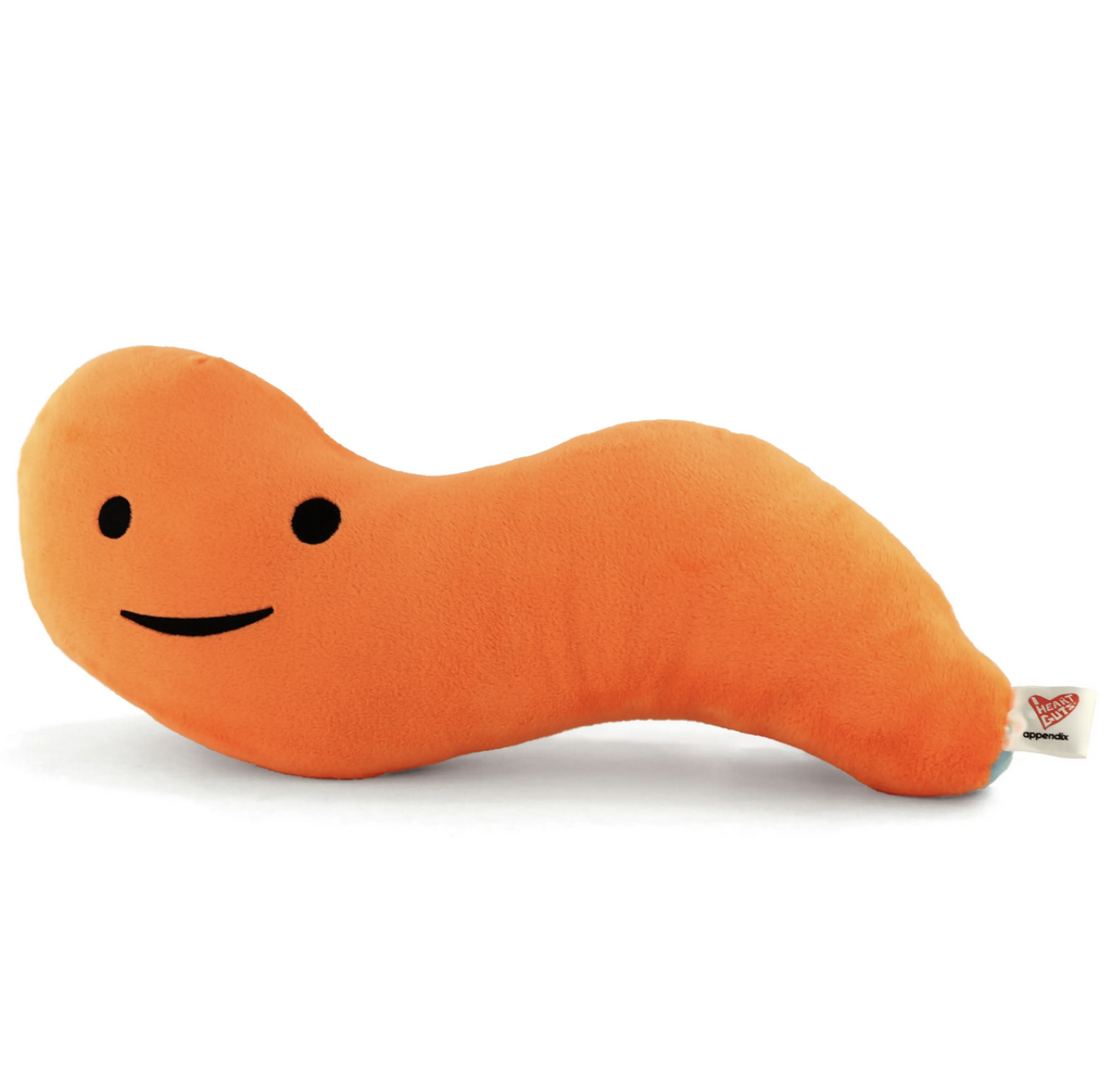 Orange plush appendix with a happy embroidered face.