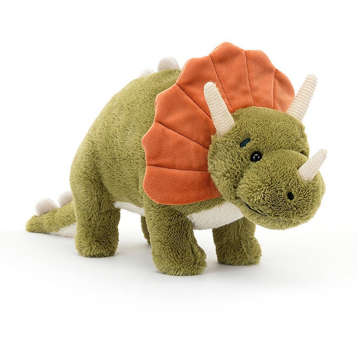 Archie the plush triceratops with green fur, orange crill and cream horns. 