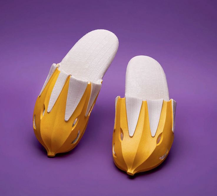 Men's slide on slippers that look like peeled bananas.