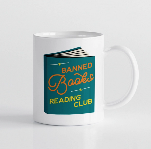 White ceramic mug with a book that reads " Banned Books Reading Club" 