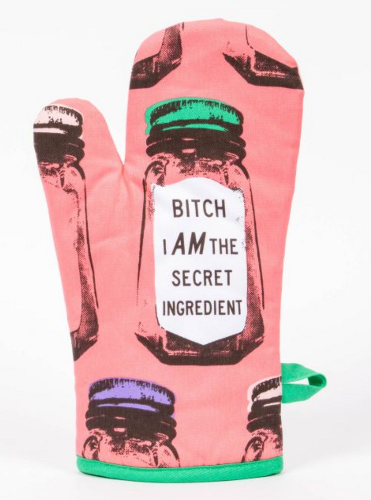 Pink oven mitt with an image of oversized salt shaker reading Bitch I AM The Secret Ingredient.