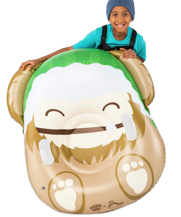 Squishamals Benny the Big Foot inflatable snow tube and a smiling child.