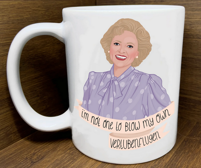 White ceramic mug with a drawing of Rose Ntland from The Golden Girls. Text reads I'm not one to blow my own Vertubenflugen.