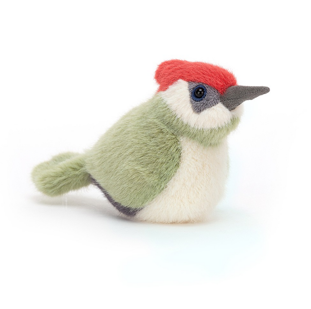 Jellycat Woodpecker Birdling plush. Woodpecker has a green body, white belly, white and grey face, dark grey beak, and of red at the crown.