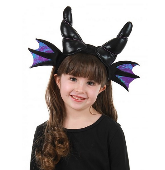 This headband pictured on a young child's head features twisted black horns made of solid stuffing and encased in soft faux leather. The band also features two tiny, shimmering wings, which are blue and purple. The "bones" of the wings are black, like the horns and the headband itself.