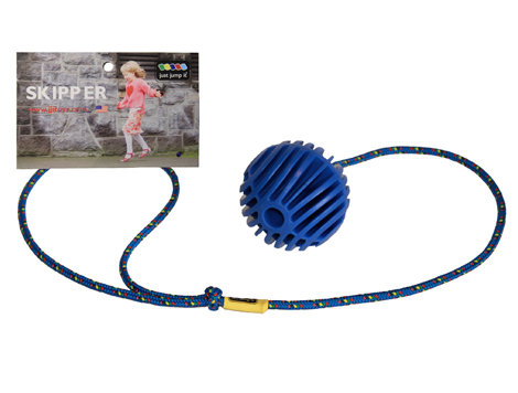 A blue textured ball attached to a multicolored blue rope with a loop on one end. There is a hangcard attached with a picture of a child playing with the skipper. 