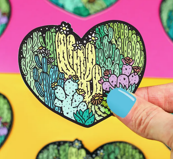 Heart shaped sticker full of drawings of different cacti.