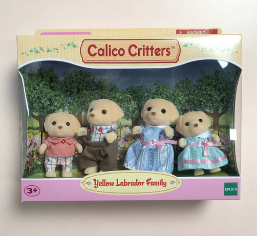 The box of the Yellow Labrador Family. The box is pink and yellow with a clear plastic window showing the 4 family members.