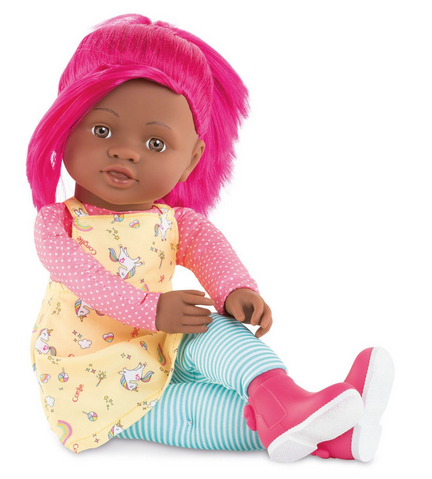 Celena Rainbow doll has long bright pink hair, a yellow tunic, pink long sleeve shirt, blue striped leggings, and pink boots. Dark skin.