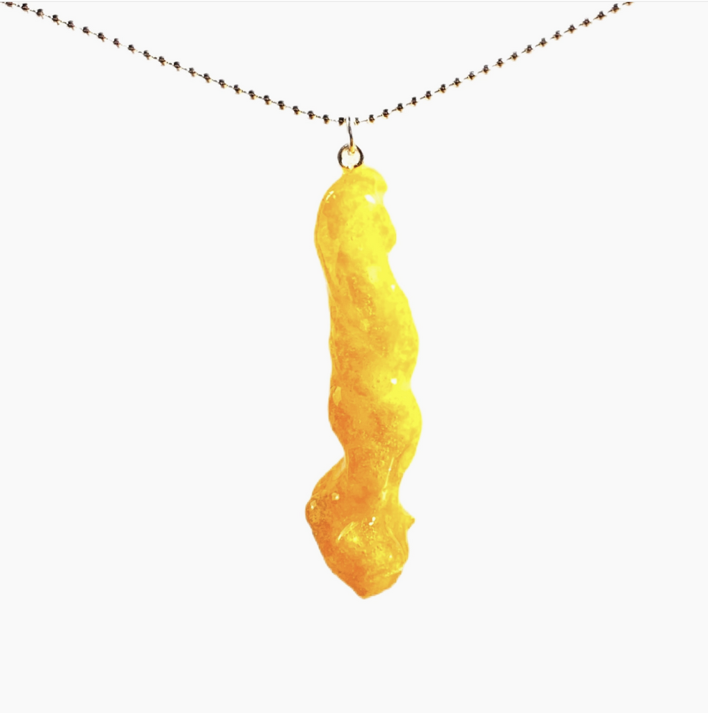 Real Cheeto dipped in glittery shellac on a necklace.
