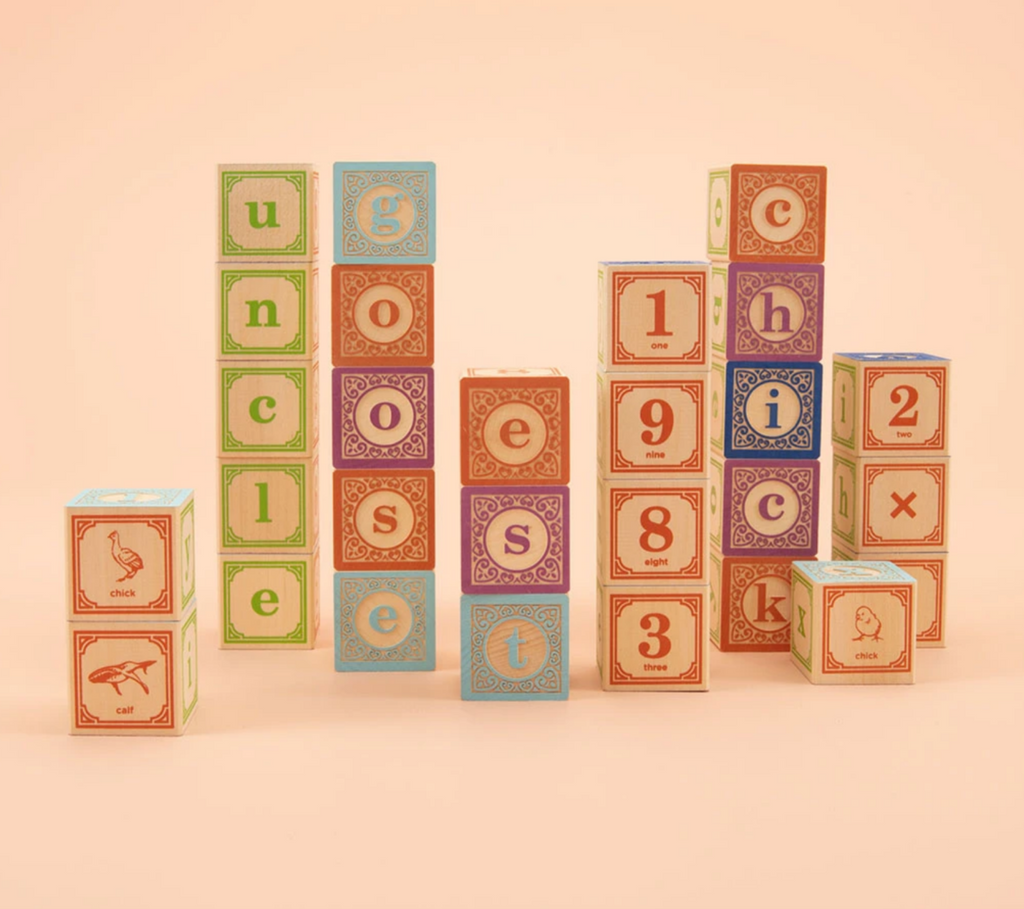 Classic Lowercase ABC wooden blocks placed in stacks.