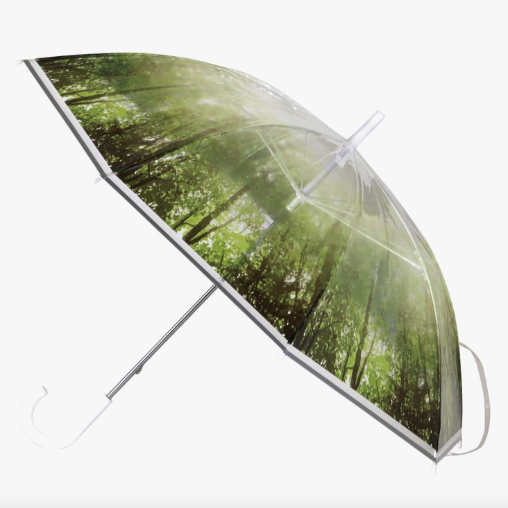 Open umbrella showing the green forest print, that is somehow still clear.