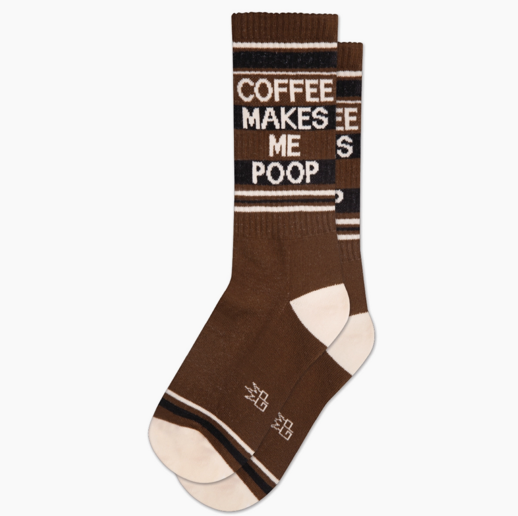 Brown athletic socks that read "Coffee Makes Me Poop" in white.