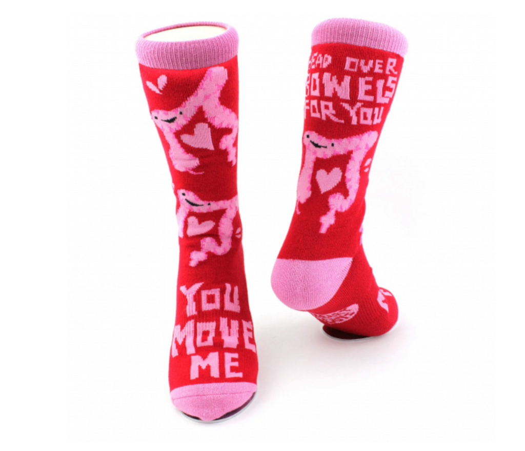 Bright red and pink knee socks with colons and hearts. They have "You Move Me" and "Head Over Bowels For You" on them. 