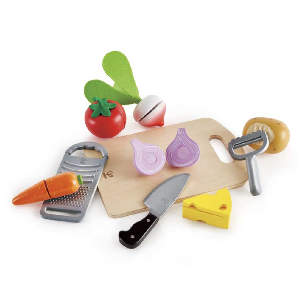 Cooking essentials play food set includes wooden cutting board, plastic knife, grater, and peeler. Wooden tomato, radish, carrot, onion, potaro, and cheese that split apart included.
