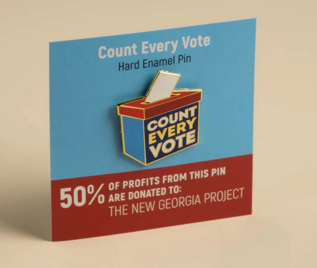 Metal lapel pin that looks like a ballot box that reads count every vote. 50% of profits from this pin are donated to The New Georgia Project.