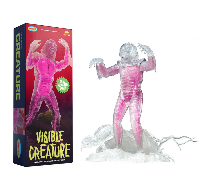 Visible Creature clear model kit box and assembled model.  The box shows the completed creature on the cover of a red and crimson box. The clear creature model is next to the box, showing the guts that are visible through the model. 