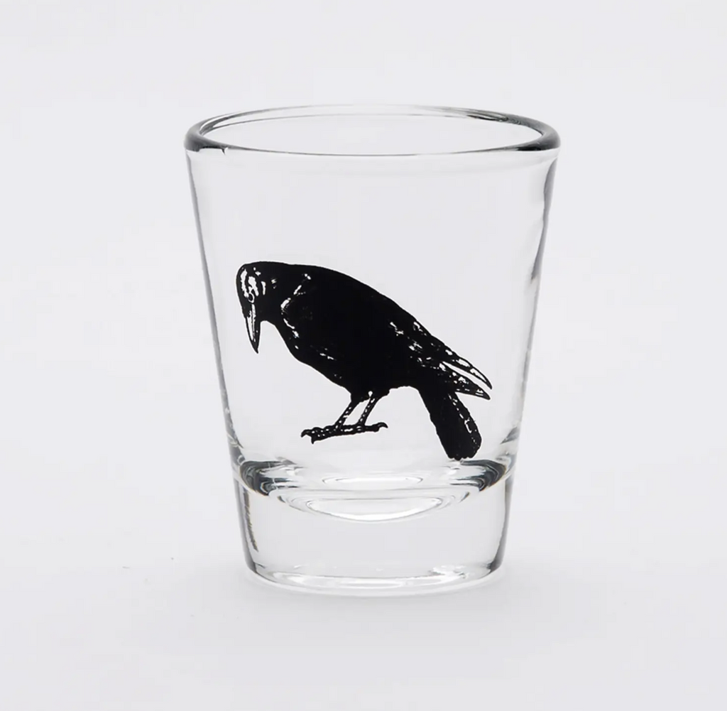 Clear 2oz shot glass. Crow printed in black ink. 