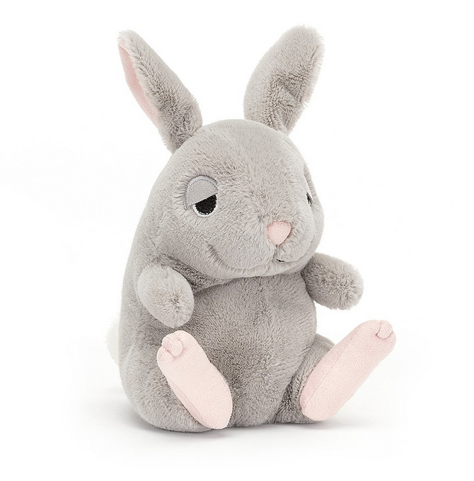 This grey bunny has a flopsy pose, embroidered eyes and suedette lids, with two-tone ears and pink feet with stitch toes. 