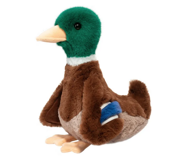 View from the side of Desie the Mallard Duck plush, he's got bright green fur on his head and rich brown fur from his chest to his tail. 