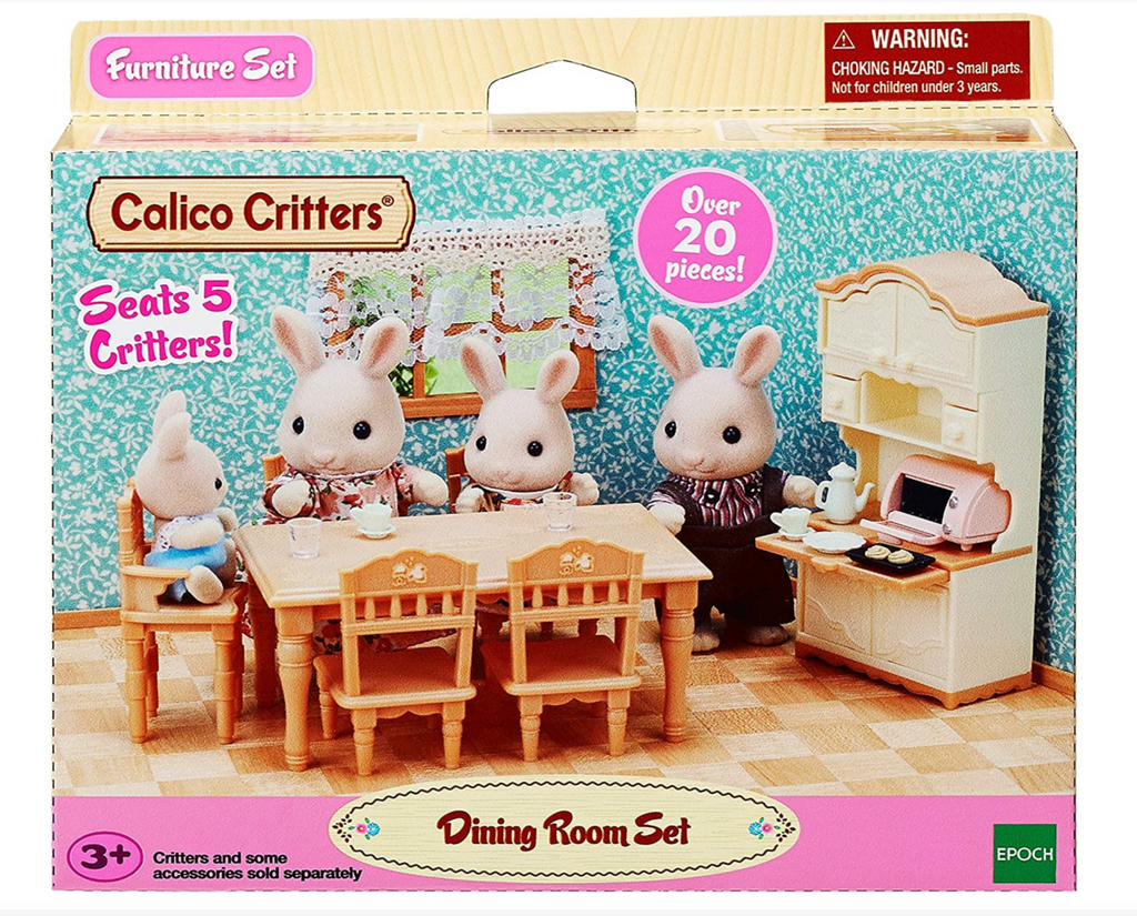 Box for the Calico Critters Dining Room Set with a picture of a rabbit family using the set, it includes a dining table and baby chair  and a delightful kitchen cabinet for storing kitchenware. Also features a tea set and toaster oven.