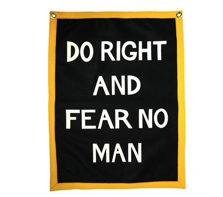 Blue and yellow felted flag says "Do Right and Fear No Man' in white.