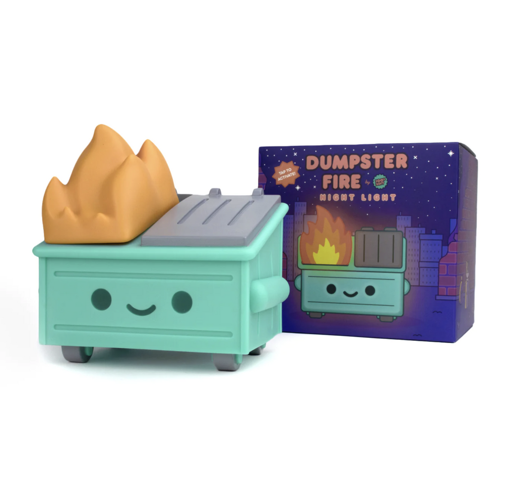 Hard vinyl dumpster fire night light by 100% Soft in front of display box.