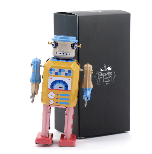 Electro Bot standing in front of black box. 