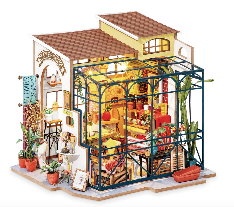 This tiny dollhouse study room will keep you busy as you design and create the perfect little space. Kids and adults alike will enjoy our 3D wood puzzle. This small house was specifically made with your enjoyment in mind, not your dolls’. This kit has everything in it that you will need to start building a mini flower shop with open walls.