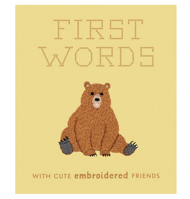 Cover of "First Words With Cute Embroidered Friends" with a pale yellow background and a picture of an embroidered bear on the front, with the printed in cross stitched letters. 