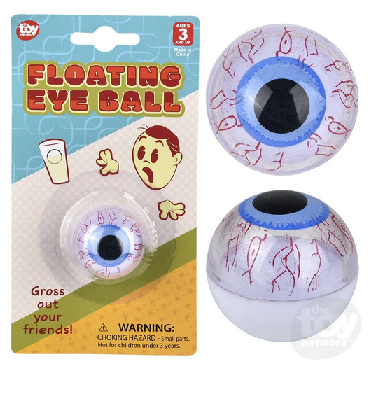 The Floating Eyeball on a blister card and out of the package showing the blue iris and blood shot whites of the toy eye. 