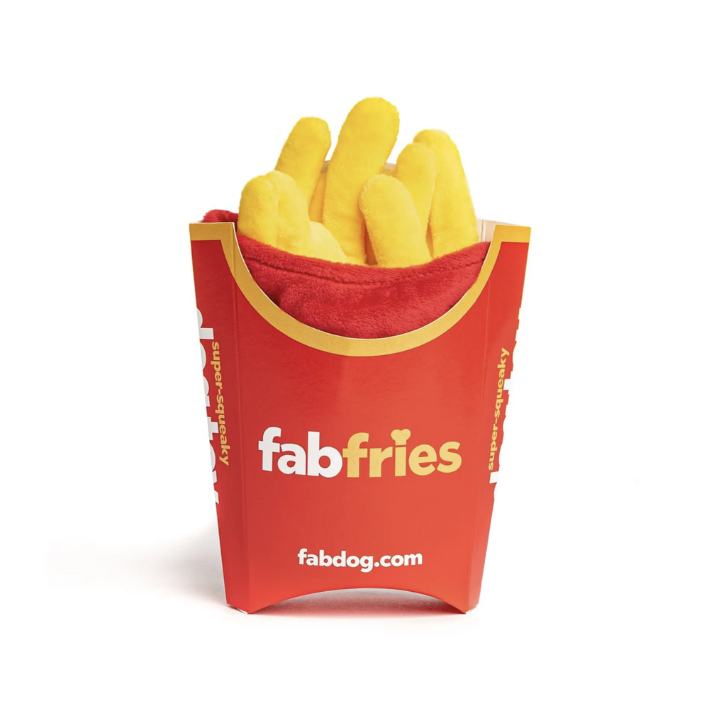 Plush fab fries dog toy looks like a red pack of french fries.
