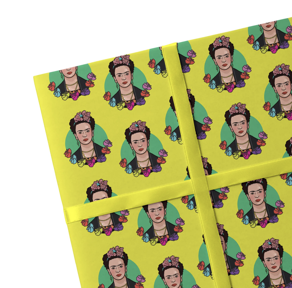 Yellow gift wrap with illustrations of Frida Kahlo surrounded by flowers.