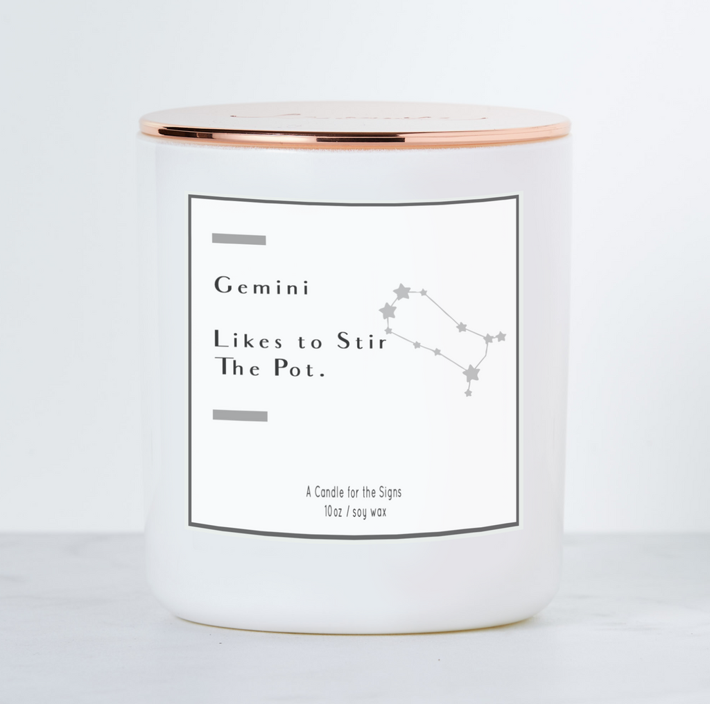 Candle in a white glass jar. Text reads "Gemini likes to stir the pot. A candle for the signs. 10oz. Soy wax."