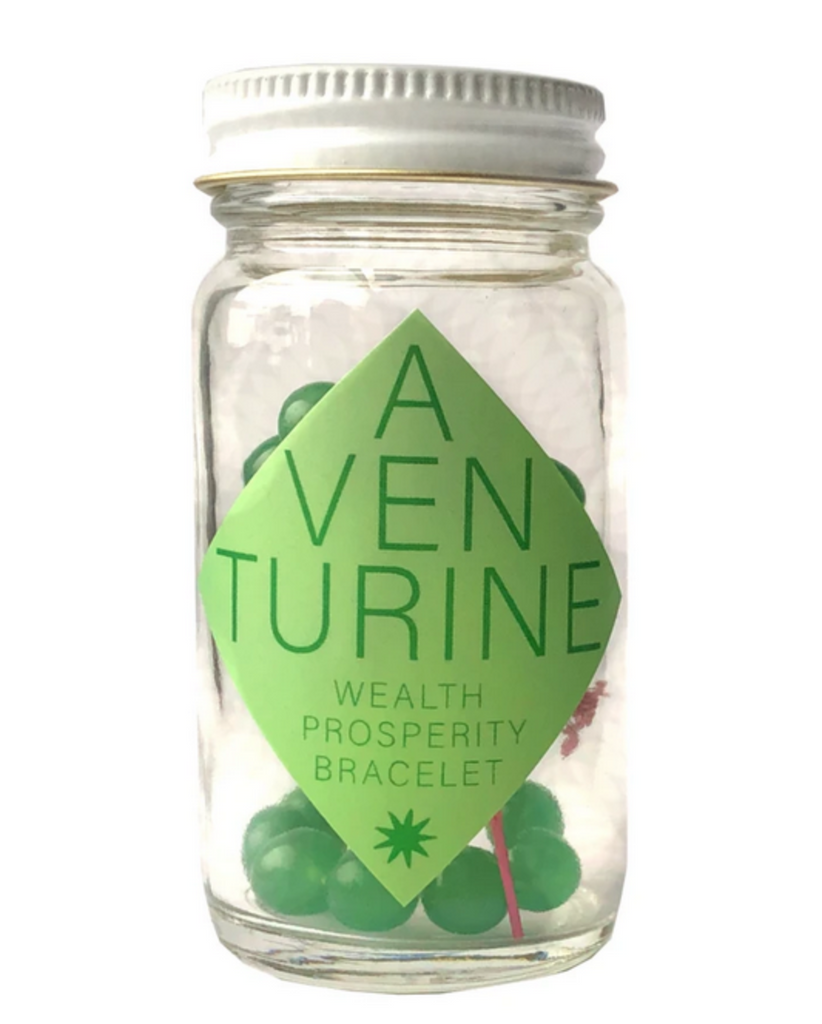 Green adventurine bracelet in a glass bottle.