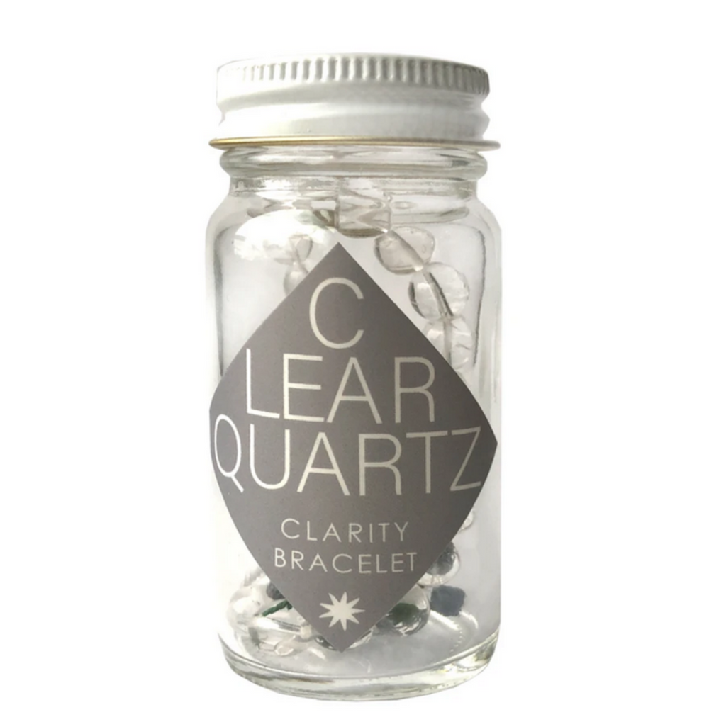 Clear quartz braceletin a glass bottle package.