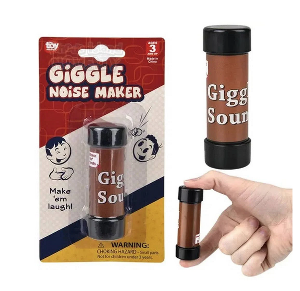 The Giggle Noise Maker is a brown, palm sized tube, Pictured here held by a hand and also packaged on a cardboard hang card with retro images. 