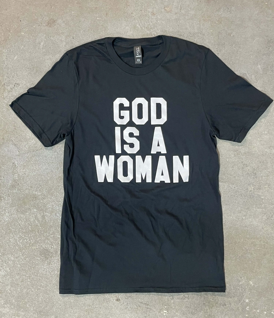 Black shirt with white text that reads "God is a woman."