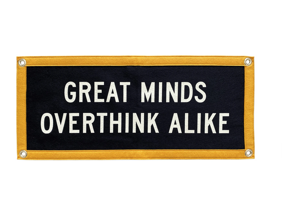 Blue and yellow camp flag reads "great Minds Overthink Alike" in white.