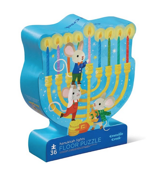 Hanukkah Lights puzzle box with  illustration that features three cute mice adding the final candle to their menorah with a backdrop of gorgeous stars. 
