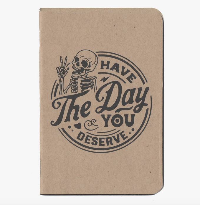 Cover of Have the Day you Deserve small notebook with  "Oatmeal Speckle Tone" ans illustration of a skeleton throwing the peace sign with the message Have the Day you Deserve.