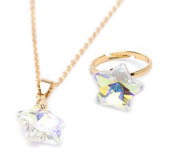 Holographic star necklace and ring set is made to fit a child's fingers with size adjustable features. This beautiful set is made with rose gold metals. A solitary holographic star dangles from the delicate chain and the ring is positioned beside it. 